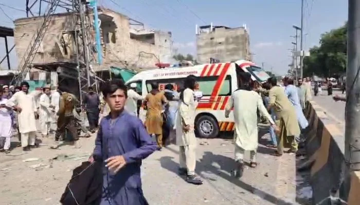 Rescue workers and an ambulance at the site of the blast in Police Lines, Kohat.
