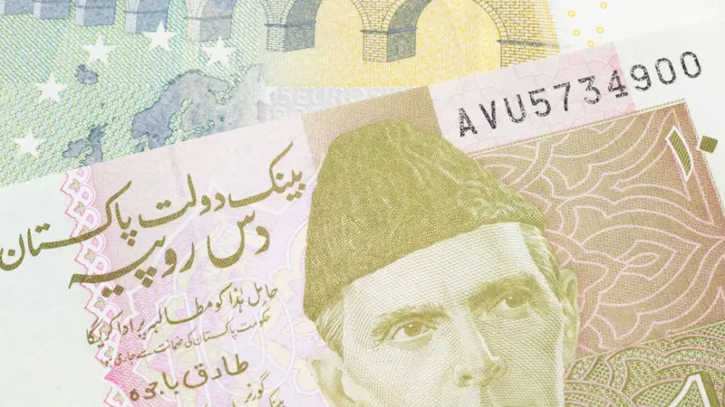 Close-up of a Pakistani ten rupee paper banknote featuring Quaid-e-Azam Muhammad Ali Jinnah.